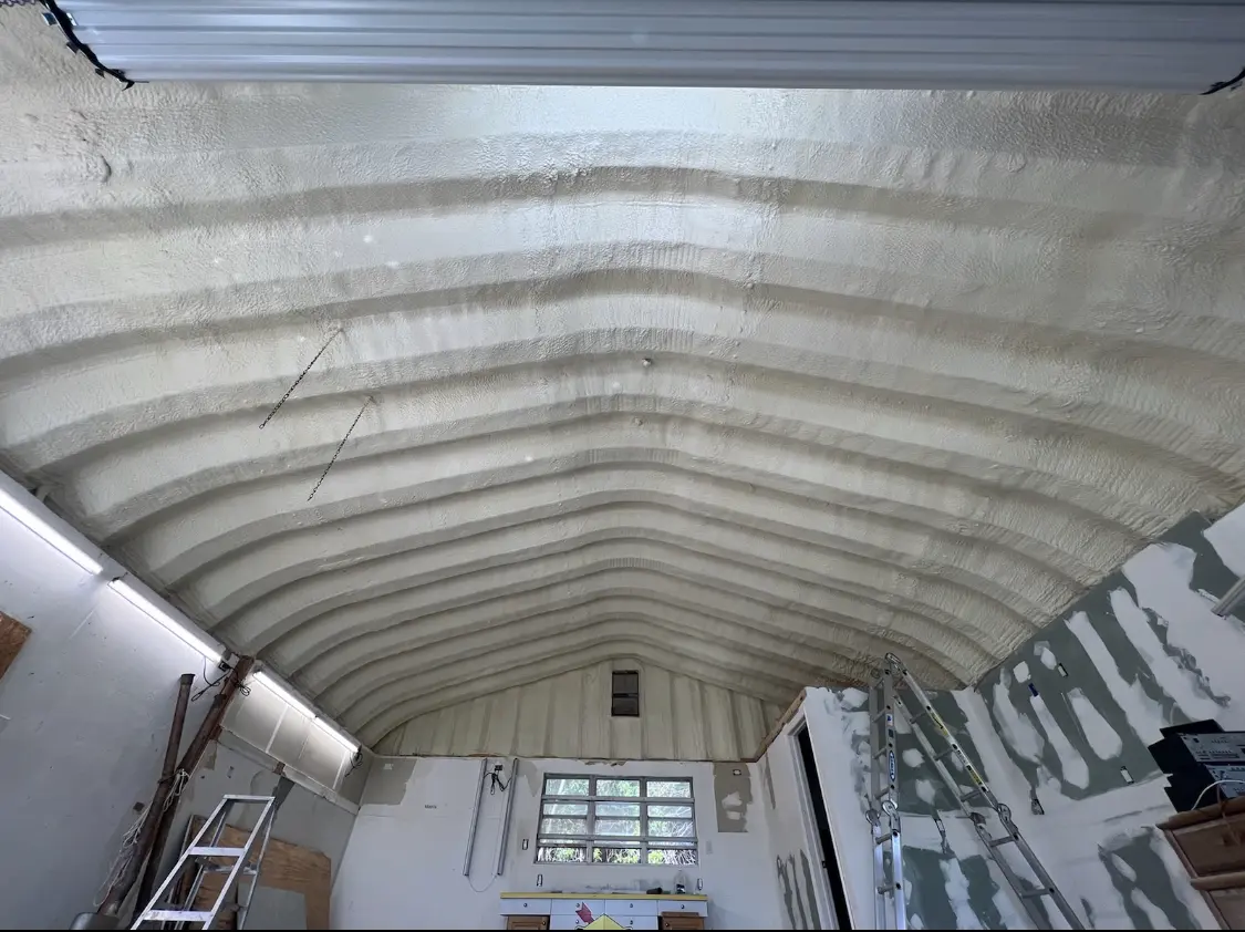 Spray polyurethane foam applied to the underside of a metal roof deck in Glenview